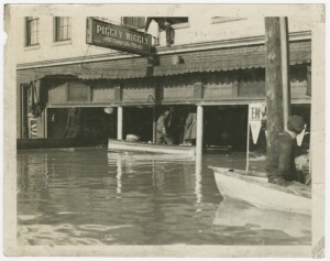 Flooded Piggly Wiggly Store. Includes a man on a boat. 