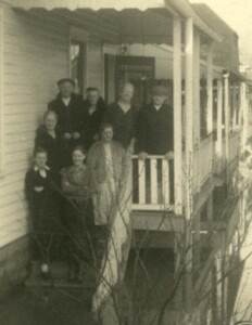 Groh Family on their porch surrounded by flood waters. 